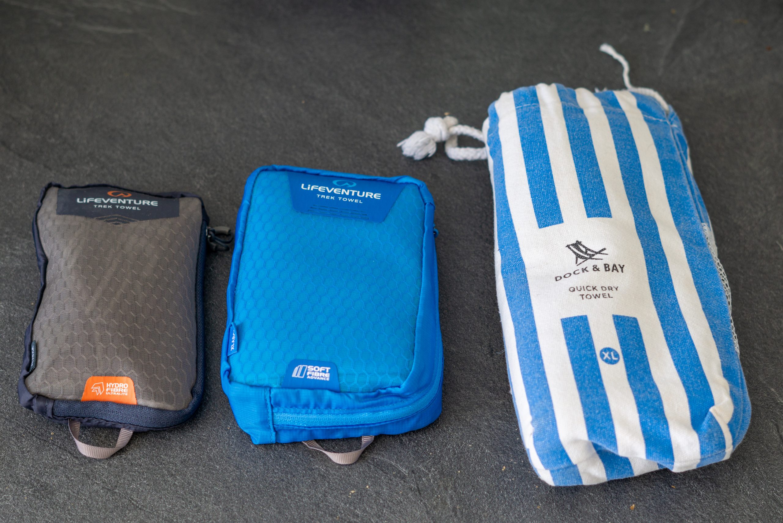 Three travel sized towels. Including Lifeventures Hydrofibre and softfibre travel towel, as well as Dock and Bays Quick Dry Towel