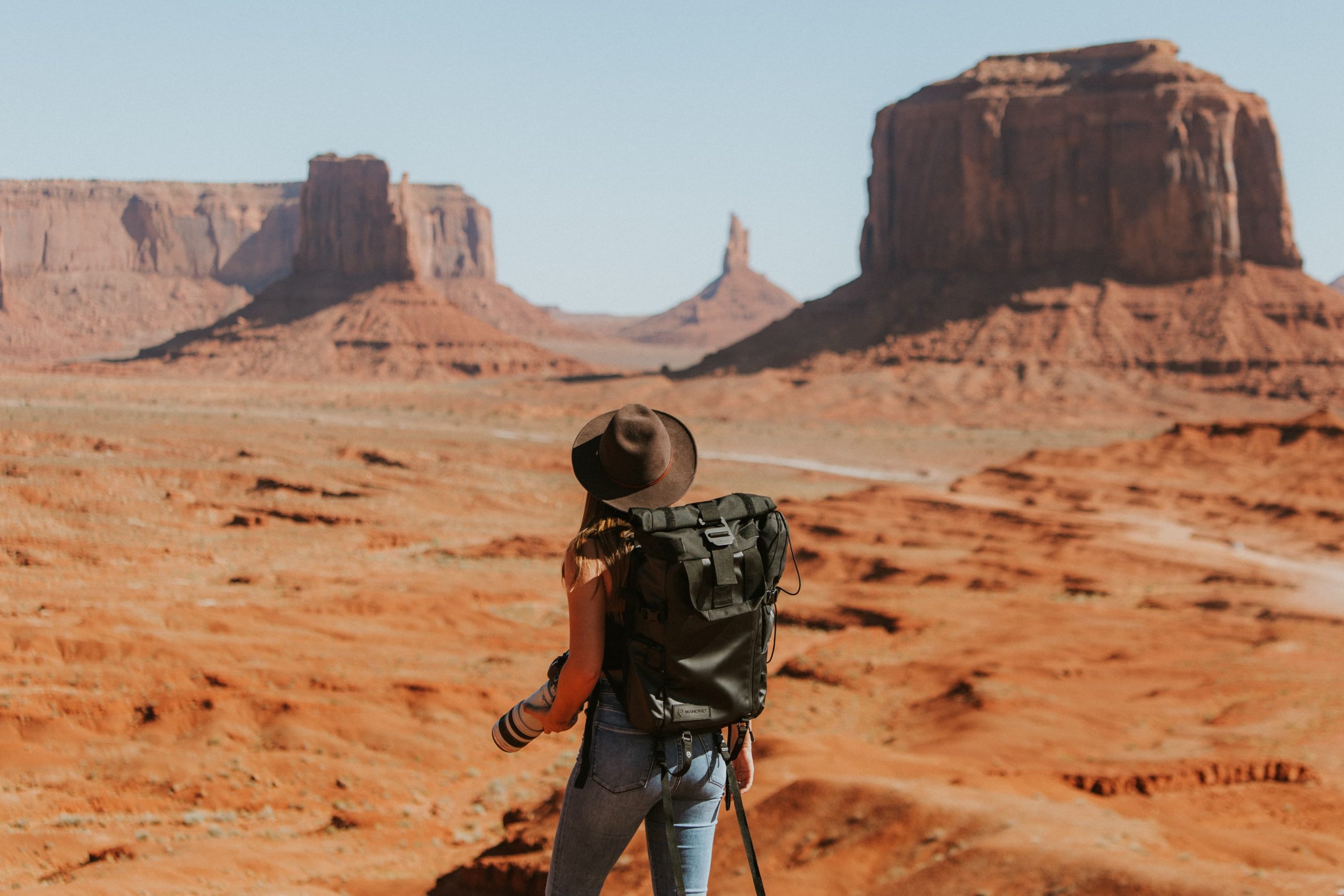 Backpacker in a canyon for a post on the solo travellers surcharge