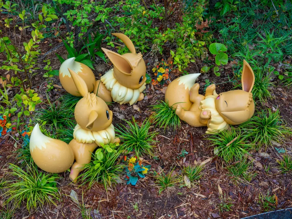 Eevee_Group_16x9 Group of Eevee playing at Poképark Kanto