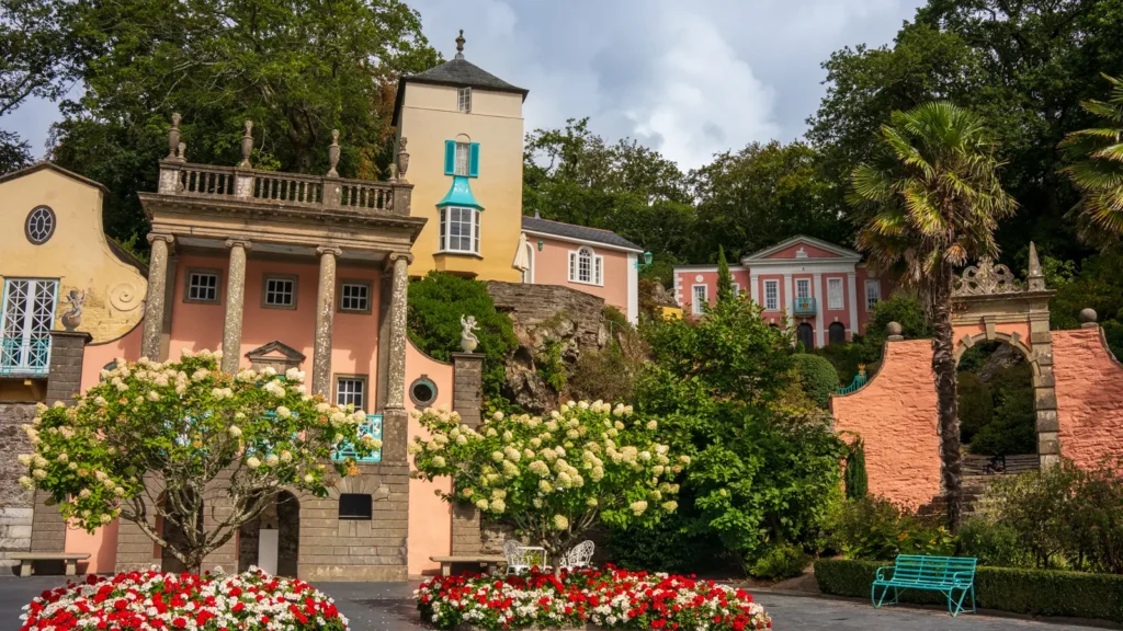 Colourful Italianate buildings, gardens and palm trees in Portmeirion village, North Wales.
